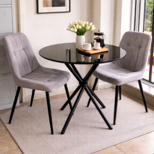Modern 2-seater dining table with cushioned chairs in a stylish compact dining setup.
