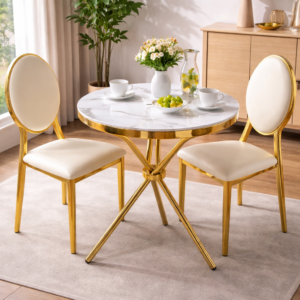 2-seater round marble top dining set with gold frame and upholstered chairs in a modern dining room setup