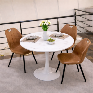Round marble-top dining table with three brown chairs in a modern dining setup