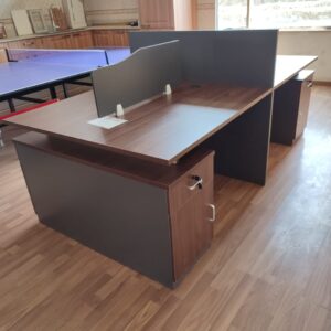 4-way wooden workstation with spacious desk surfaces and integrated storage