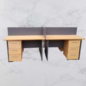 Custom 4-way office workstation with four desks, privacy partitions, and shared workspace design