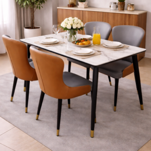 Elegant marble-top dining table with four modern cushioned chairs in a stylish dining setup