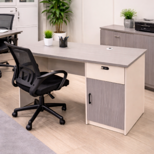 Executive 1.2m office desk with grey finish, storage cabinet, and modern office setup with chair.