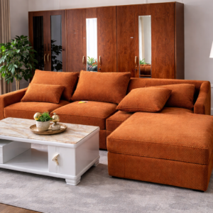 L-shaped 5-seater burnt orange couch with HD cushions in a modern living room setup