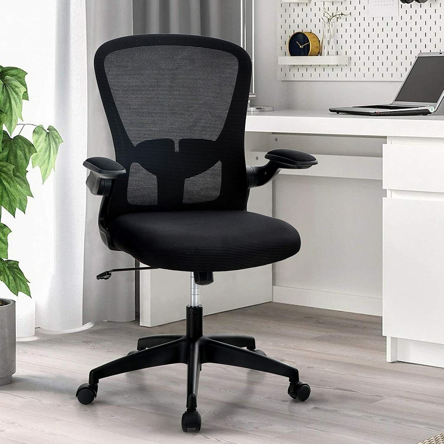 Ergonomic mid-back office chair with padded seat, armrests, and swivel wheels for office workstations