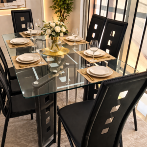 Modern 6-seater glass dining table set with high-back chairs in a stylish dining room