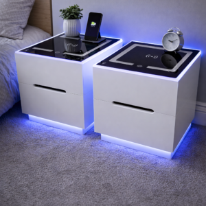 Modern white LED bedside table with wireless charging and optional strip lights creating ambient glow in a stylish bedroom
