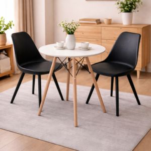 Modern minimalist dining set with a round table and elegant chairs in a bright, stylish dining room setup.
