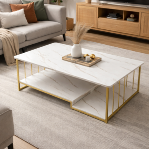 Modern living room coffee table with a white marble-look tabletop, gold metal frame, and lower storage shelf in a stylish indoor home setup.