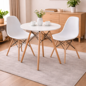 Modern minimalist dining set with a round white table and sleek chairs in a bright, stylish dining room setup.