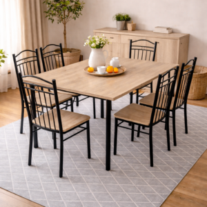 Modern dining set with a natural wood tabletop and black metal chairs placed in a bright dining room with soft décor accents.