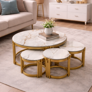 4-in-1 luxury nesting coffee table set with marble-look tops and gold legs in a modern living room setup.