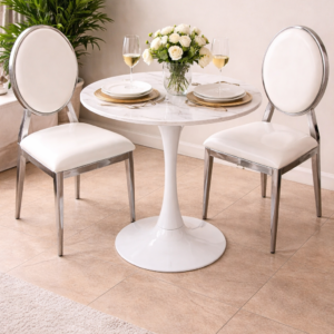 Silver and white 2-seater dining set with marble-effect round table and upholstered chairs in an elegant dining setup.