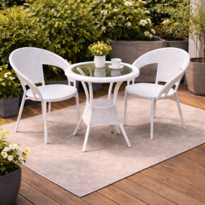 Stylish wicker outdoor table and chairs set in a garden patio setup