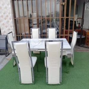 Premium silver-finish 6-seater dining set with marble top and upholstered chairs