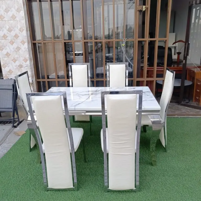 Premium silver-finish 6-seater dining set with marble top and upholstered chairs